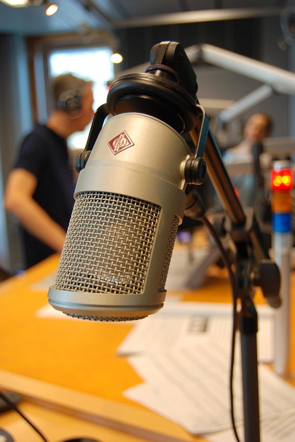 Radio news studio with a microphone and presenters