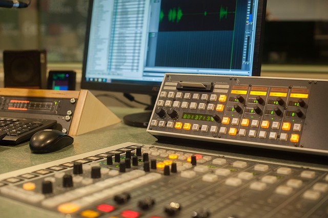Radio studio mixing desk and audio editing software